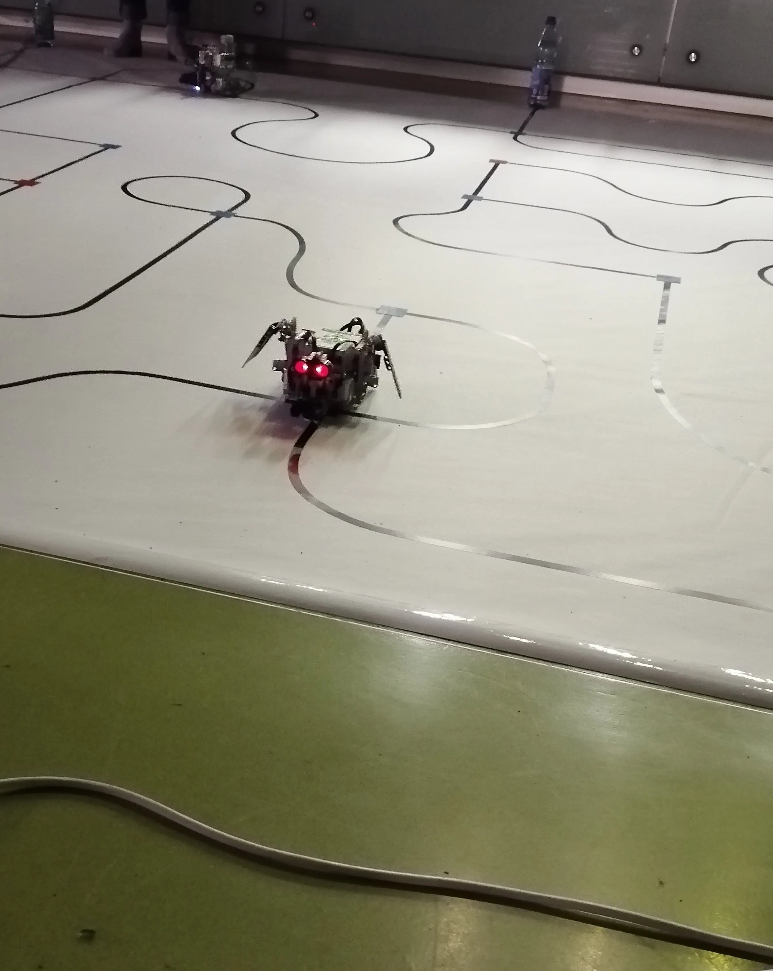 Our amazing mindstorm robot solving one of the mazes. Its a dragon with moving wings and red glowing eyes to detect obstacles.